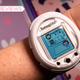 A photo of the Tamagotchi Smart worn as a smartwatch
